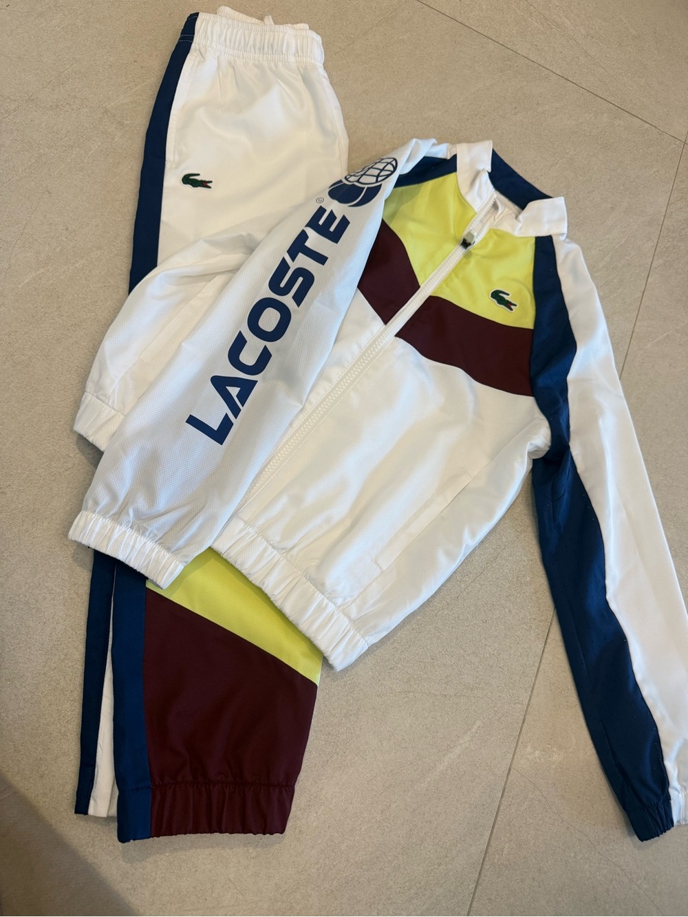 Kids 
Lacoste White Track Jacket and Pants with Navy, Maroon, and Yellow Accents